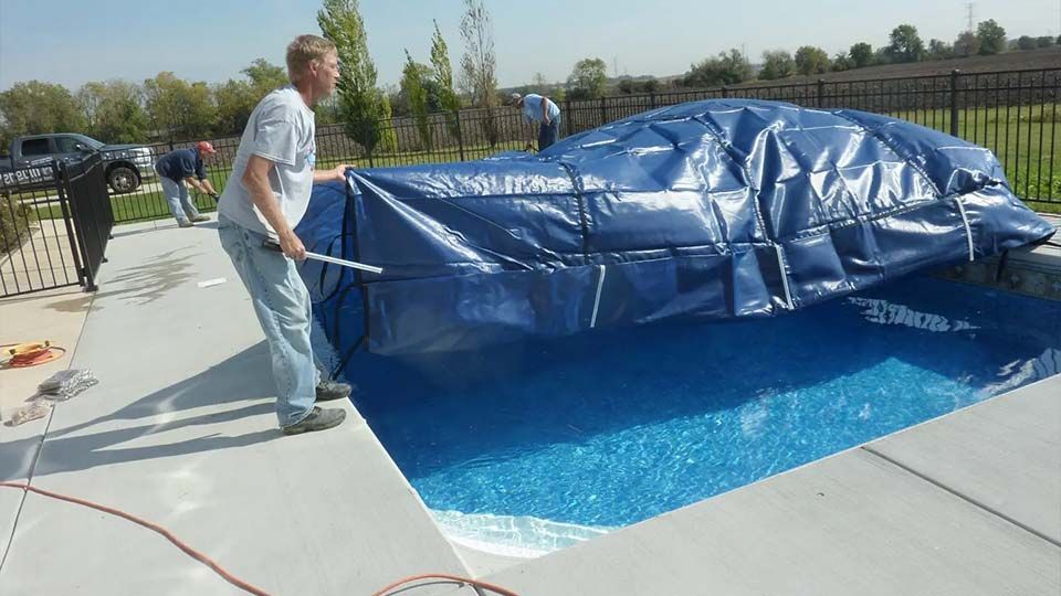 Pool technicians begin process of opening inground pool