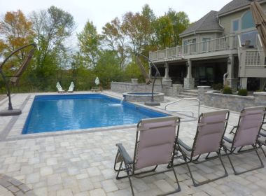 inground pool with paver patio